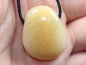 Preview: Orange calcite on cord