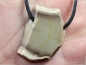 Preview: Fossilized wood on cord