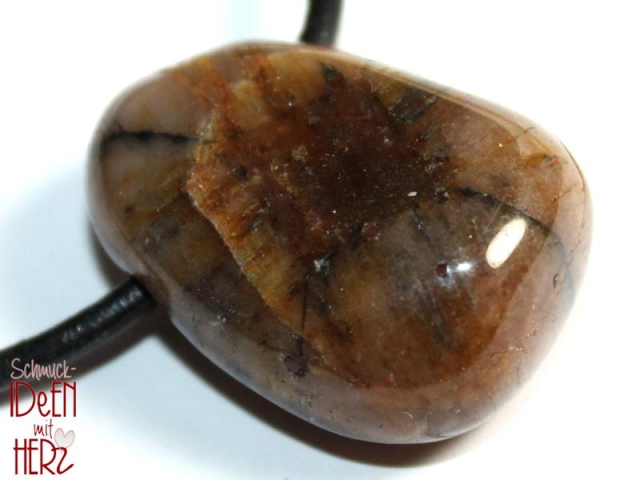 Cross stone on cord