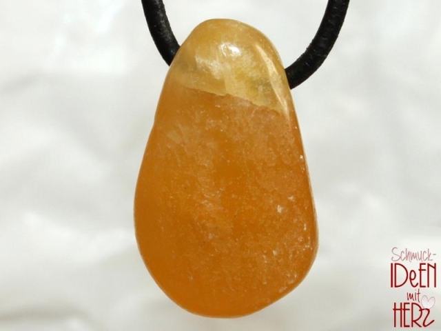 Orange calcite on cord