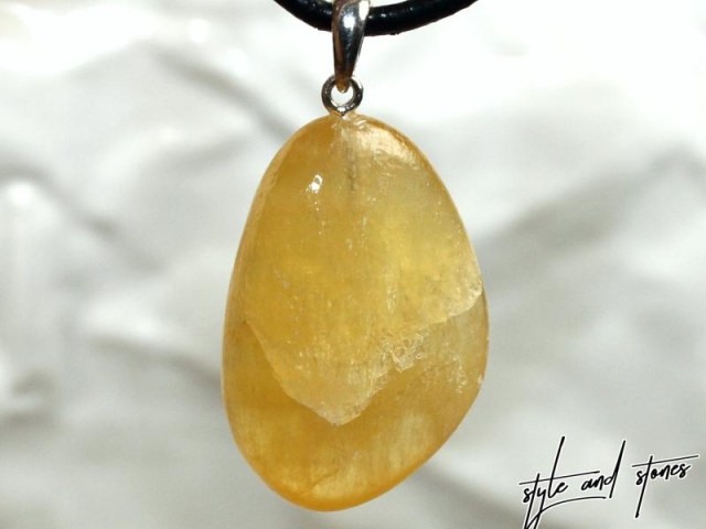 Orange calcite on cord