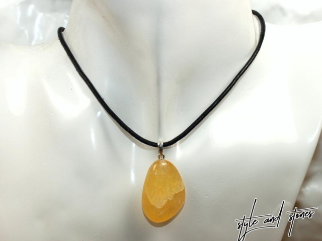 Orange calcite on cord