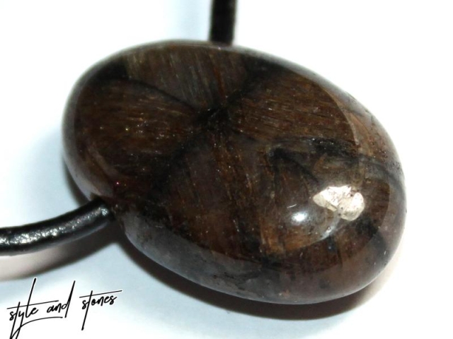 Cross stone on cord