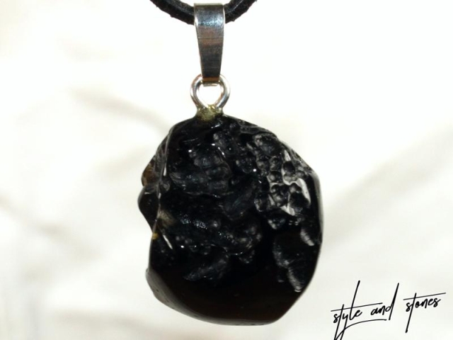 Tektite on cord