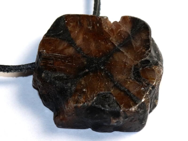 Cross stone on cord