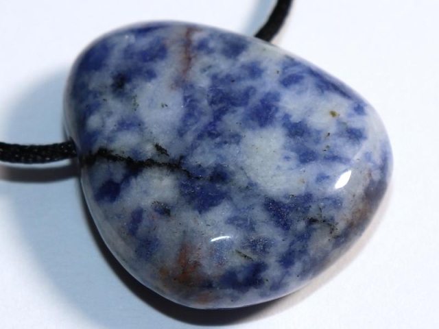 Sodalite feldspar on cord