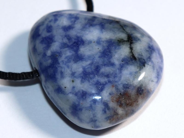 Sodalite feldspar on cord