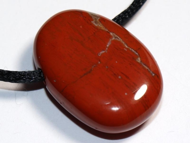 Red jasper on cord