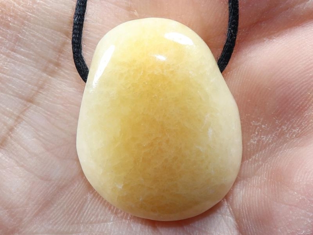 Orange calcite on cord