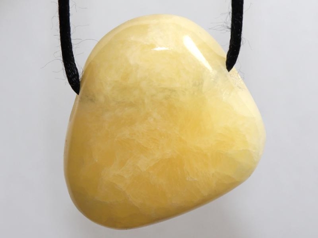 Orange calcite on cord