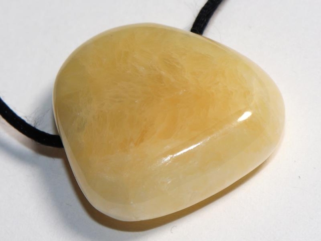 Orange calcite on cord