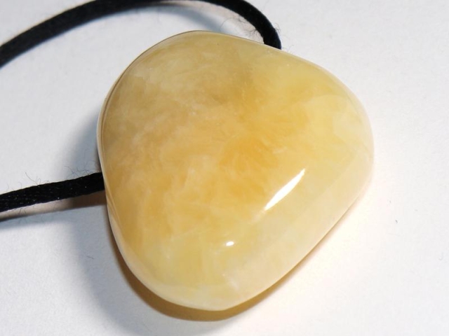 Orange calcite on cord