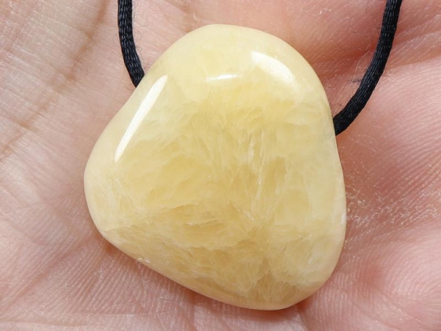 Orange calcite on cord