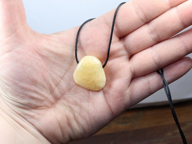 Orange calcite on cord