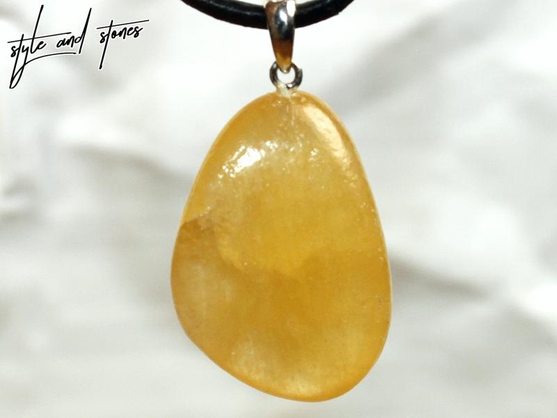 Orange calcite on cord