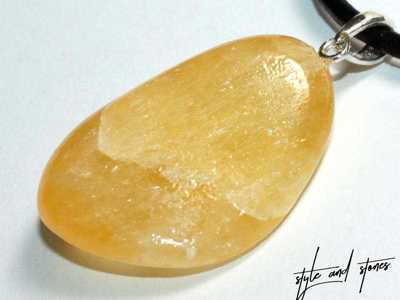 Orange calcite on cord