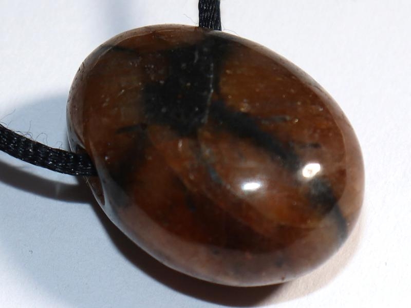 Cross stone on cord