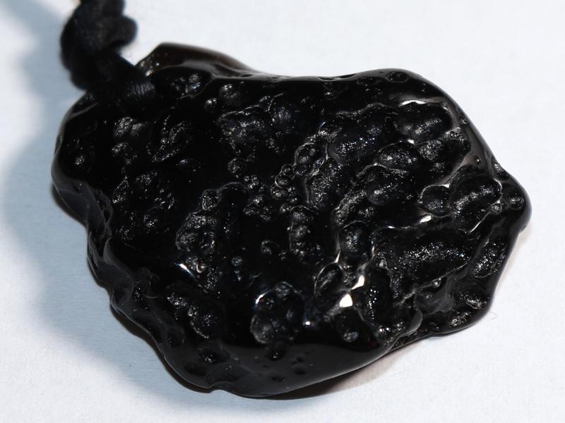 Tektite on cord