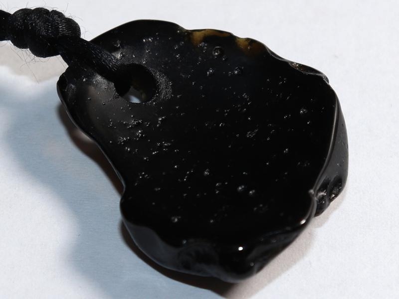 Tektite on cord