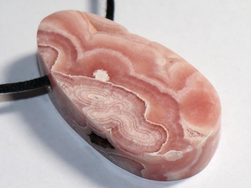 Rhodochrosite on cord