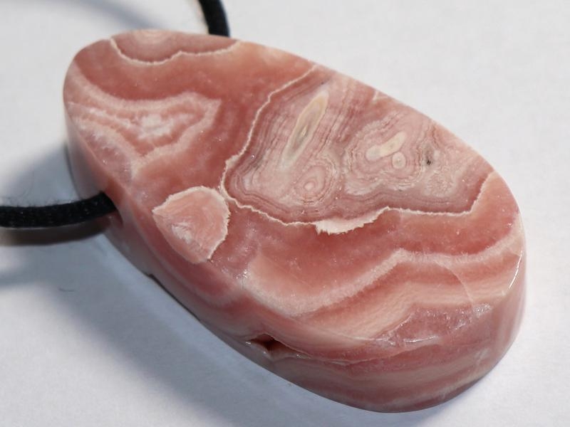 Rhodochrosite on cord