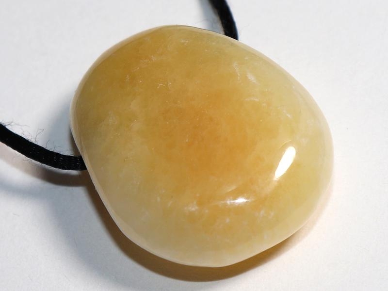 Orange calcite on cord