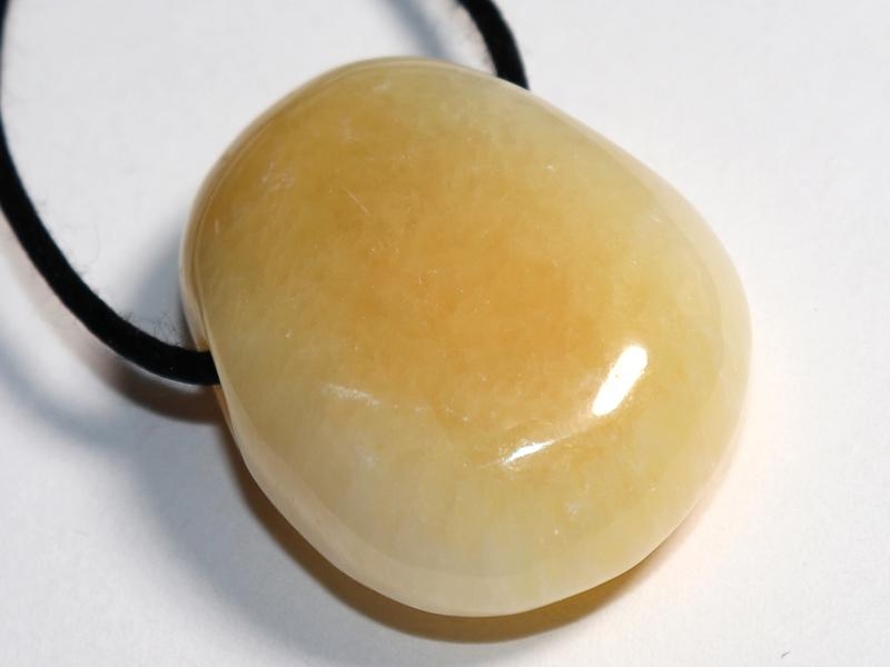 Orange calcite on cord