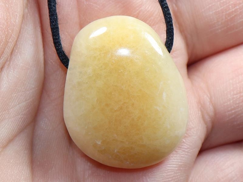 Orange calcite on cord