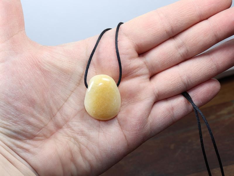 Orange calcite on cord